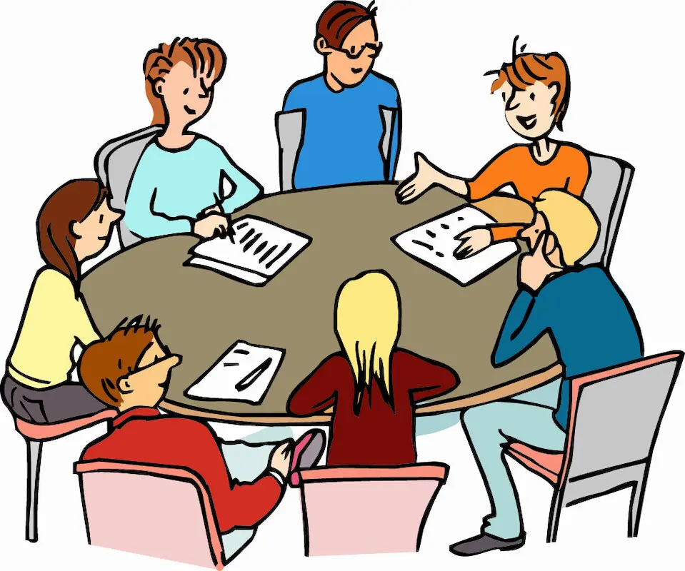 Jugendliche besprechen © Kassing Junge Menschen sitzen um einen runden Tisch herum. Sie reden miteinander. Einige von ihnen haben Papier vor sich und schreiben.