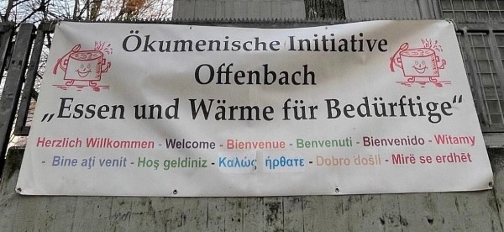 Banner mit der Aufschrift Ökumenische Initiative Essen und Wärme für Bedürftige